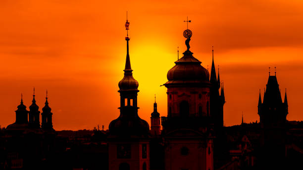 czech republic, prague - spires of the old town and tyn church at sunrise stock photo