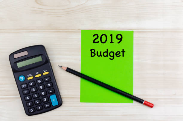 istock 2019 Budget Planning. Top view of calculator with sticky notes. Budget, financial, analysis planning concept or other your content. 999824034