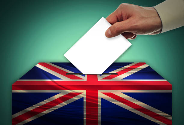 istock Man voting on elections in - UNITED KINGDOM 999824620