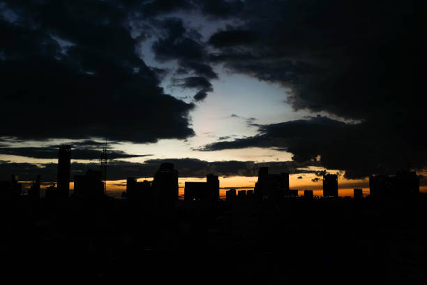 istock Sunset over the city with clouds sky 999824902