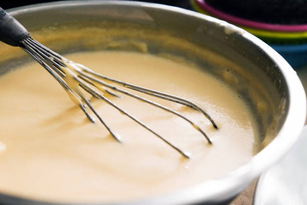 istock Mixing batter or dough for pancake or making desserts.Close up ,soft focus 999824916