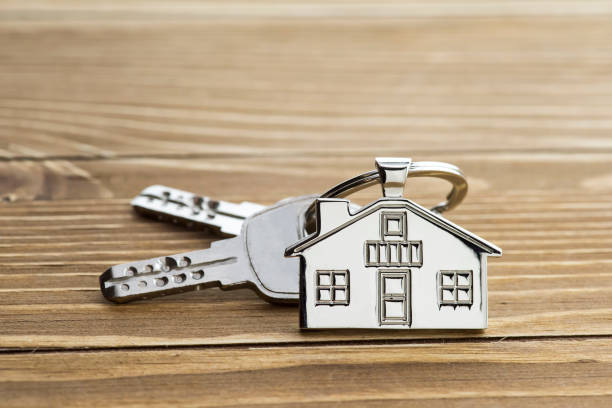 istock House Key And Key chain On Wooden Table 999836762