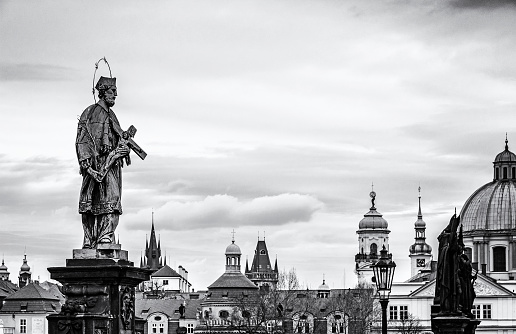 St. John Of Nepomuk Statue on Charles Bridge in Prague, Czech republic. Travel destination. Cultural heritage. Black and white photo.