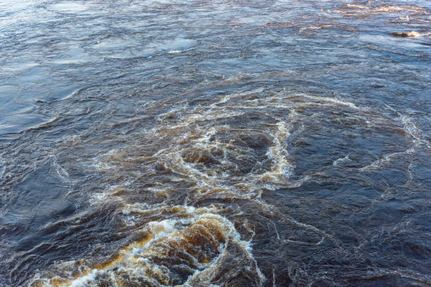 istock Seething water in the river as a background. View from above 999849078