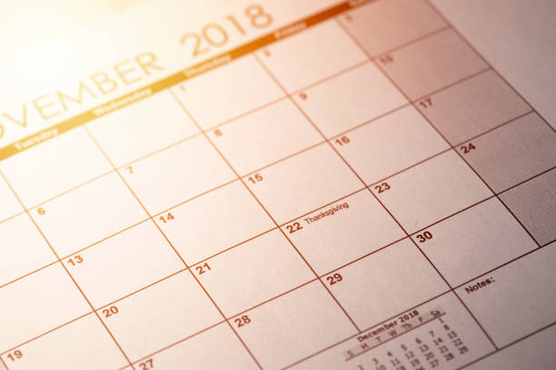 November 22. Thanksgiving in United States 2018 in selective focus on calendar. Toned image. November 22. Thanksgiving in United States 2018 in selective focus on calendar. Toned image thanksgiving holiday hours stock pictures, royalty-free photos & images