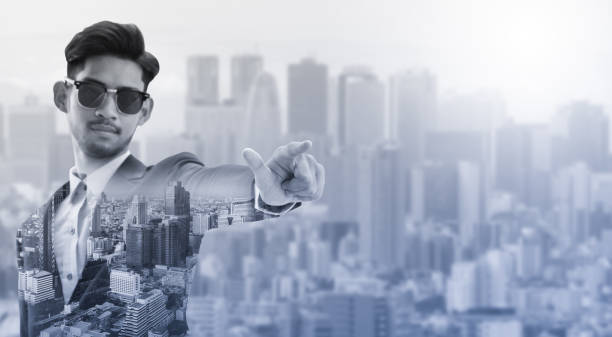 istock Double exposure businessman pointing at copy space 999852668
