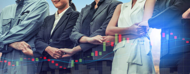 istock Double exposure business people holding hands. 999854740