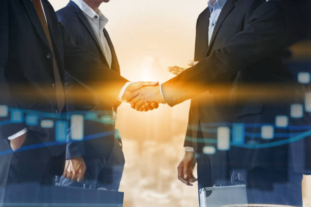 istock Double exposure Business People Handshake Meeting 999854742
