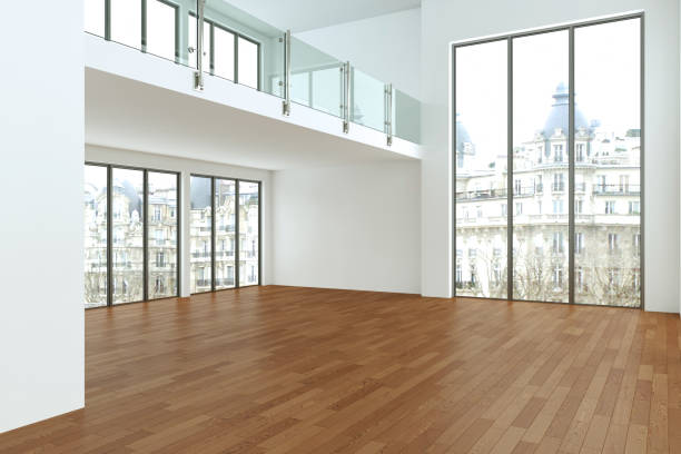 istock Empty loft room with white walls big windows and wooden floor 999855028