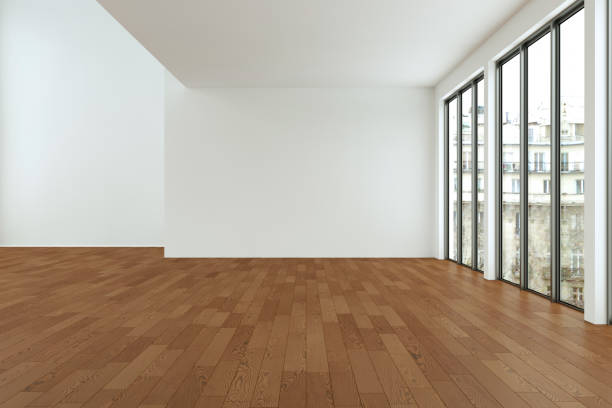 istock Empty loft room with white walls big windows and wooden floor 999855212