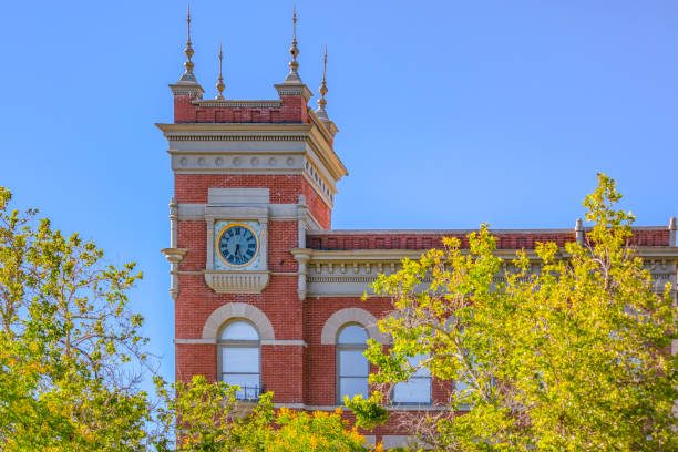 istock Clock tower on corner of building 999859696