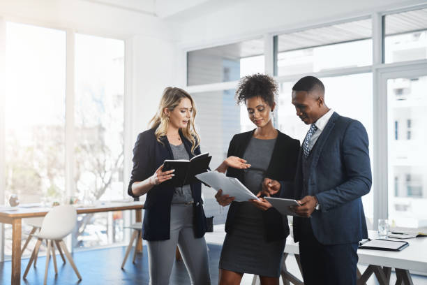istock Summing up their latest business reports together 999868232