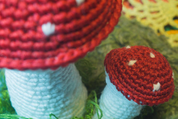 istock Handmade knitted toy mushroom isolated on white 999876334