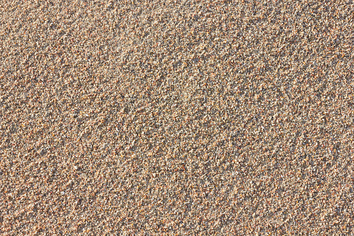 Coarse sand background texture, beach sand background