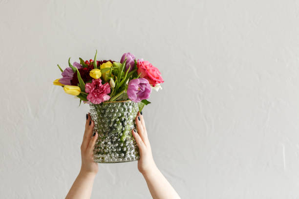 istock Person with colorful flowers 999876598