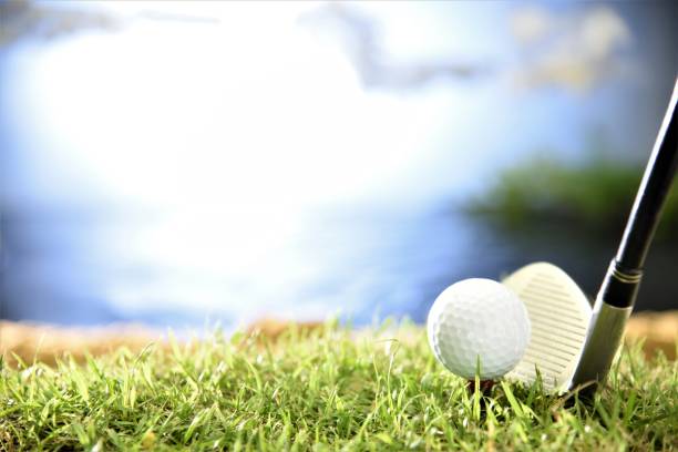 istock golf ball on tee with club head 999877566