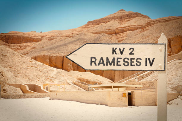 Valley of the Kings in Luxor Sign with direction to the tomb of Rameses IV in the Valley of the Kings in Luxor, Egypt medinet habu stock pictures, royalty-free photos & images