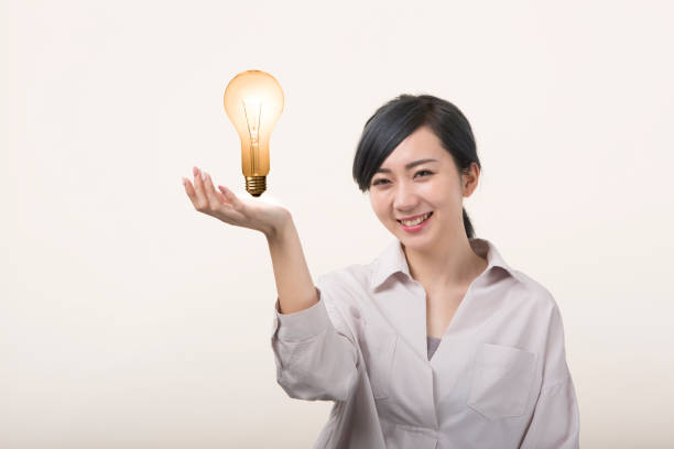 istock Young woman having a light bulb 999892988