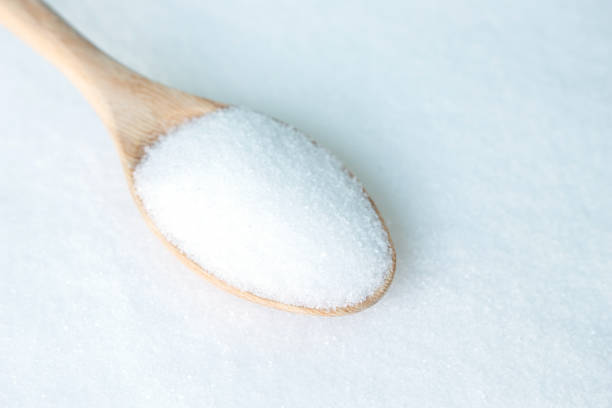 istock salt white  food cooking on spoon and background 999893656
