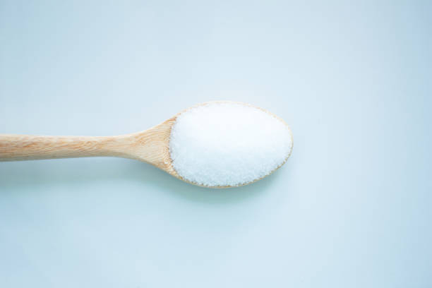 istock salt white  food cooking on spoon and background 999895146