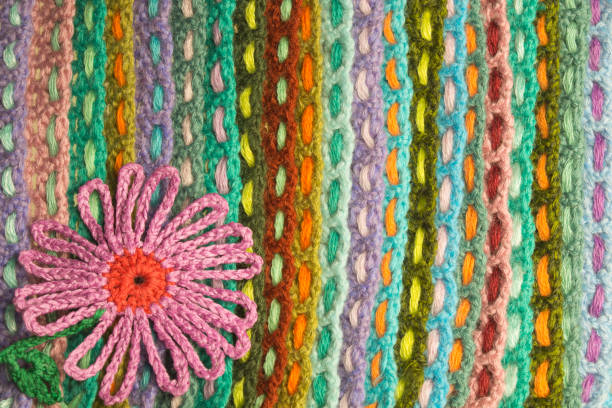 istock Handmade flower knitted wool colorful texture background 999896408