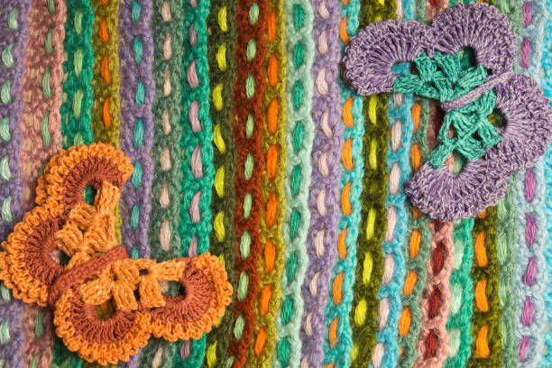 istock Handmade flower knitted wool colorful texture background 999896464