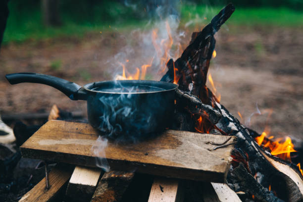 istock Pot of boiling water on a campfire 999899196