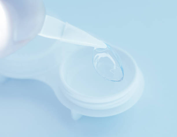 istock Tweezer taking contact lens. 999911180