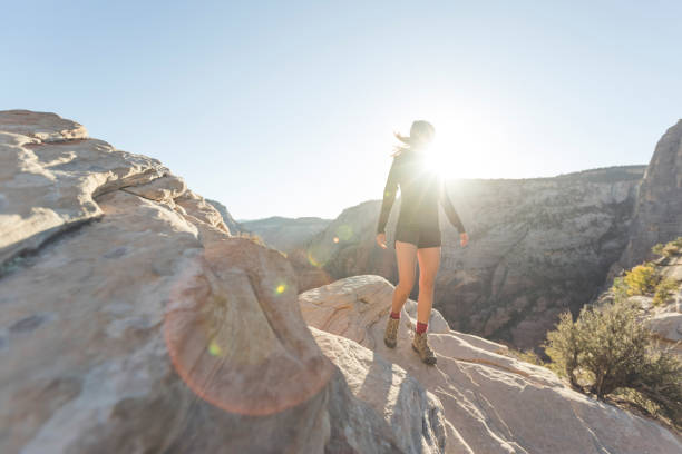 istock Female hiker in the mountains at sunrise 999913300