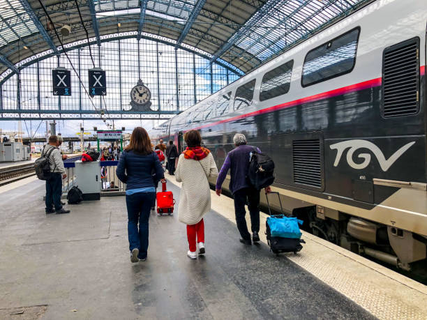 Bordeaux, France - April 30, 2018: Bordeaux Train station platform with passengers walking with luggage