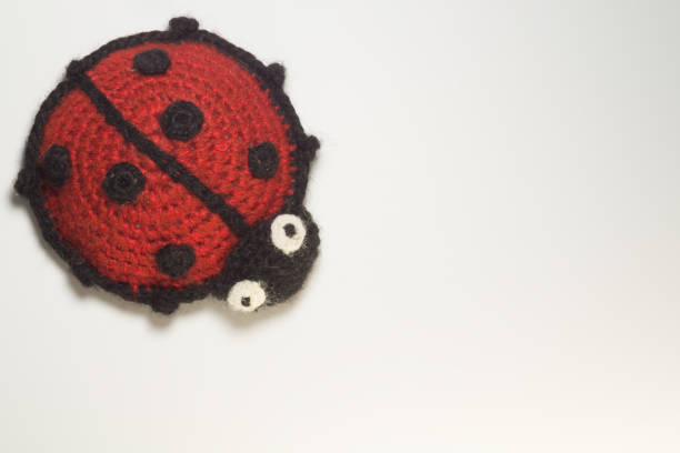 istock Knitting wool toy ladybug isolated on white 999934788