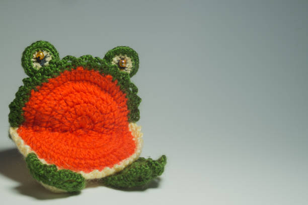 istock Handmade knitted toy frog isolated on white background 999935246
