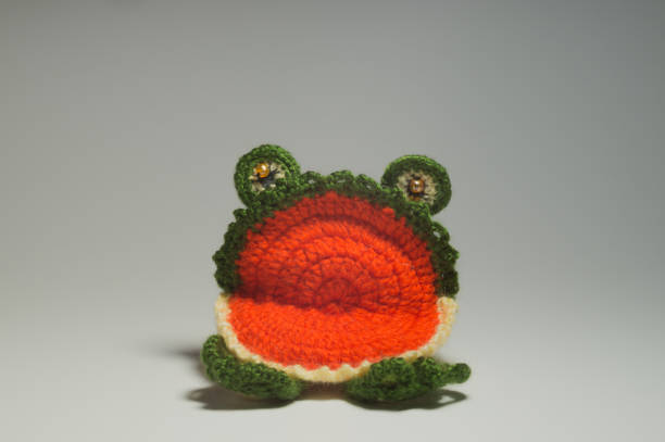 istock Handmade knitted toy frog isolated on white background 999935316