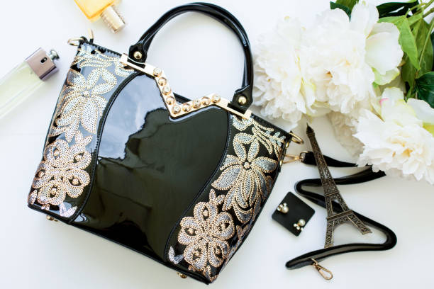 istock Stylish female accessories, sunglasses, black bag. 999935414