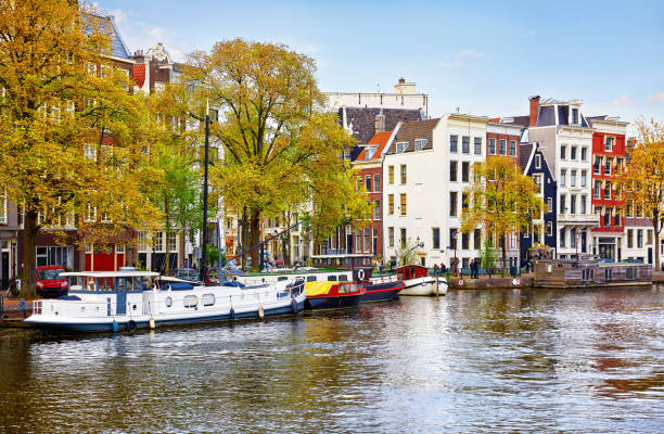 istock Bridge over channel in Amsterdam Netherlands houses river Amstel 999936744