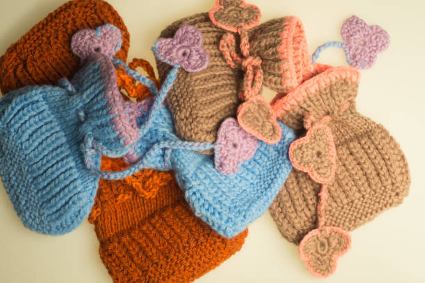 istock Handmade knitting baby booties isolated on white 999939526