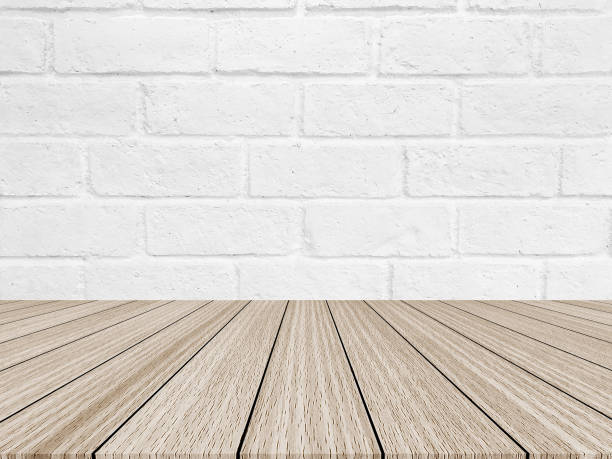 istock Vintage white of brick texture background with modern cream wood panel table top floorboards perspective for show advertise,promote product or item concept. 999945054