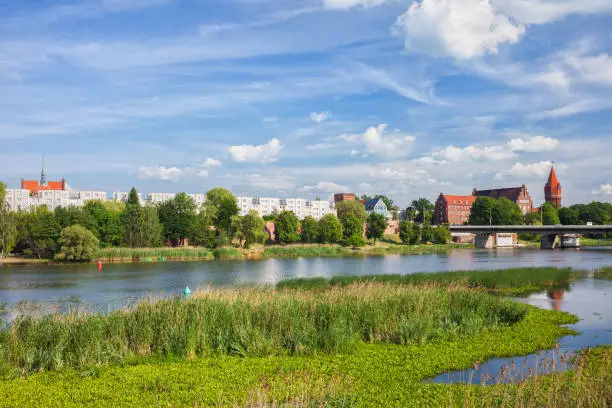 City skyline of Malbork in Poland with blocks of flats, apartment builings at the Nogat River