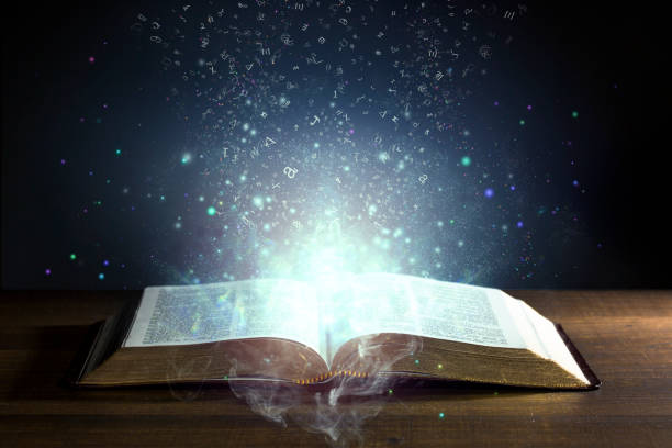 istock Knowledge coming out of a Holy Bible 999974404