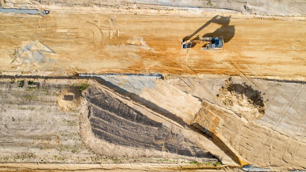 istock Excavator on a construction site, France 999975340