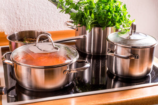 istock cooking pots on the stove 999980406