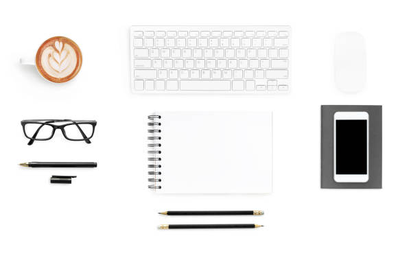 istock Blank notebook is on top of white office table. Top view, flat lay. 999980820