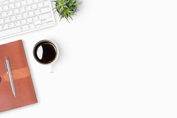 istock White office desk table with supplies. Top view with copy space, flat lay. 999980856