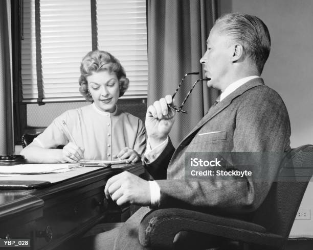 Man Talking Woman Taking Notes Stock Photo - Download Image Now - Office, 1950-1959, Adults Only