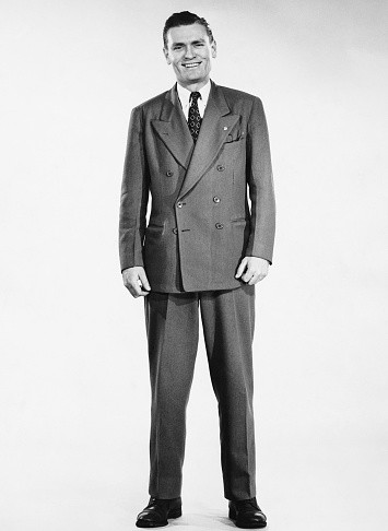 Vintage image from the 30s serious senior man dressing as a politician looking at the camera