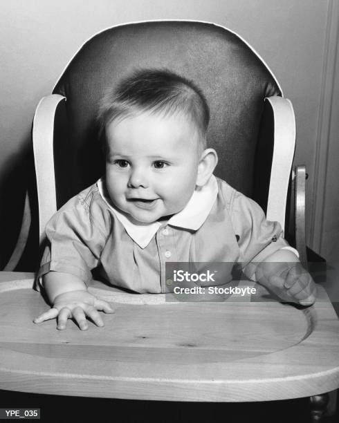 Baby Sitting In High Chair Stock Photo - Download Image Now - 1950-1959, Baby - Human Age, Photography