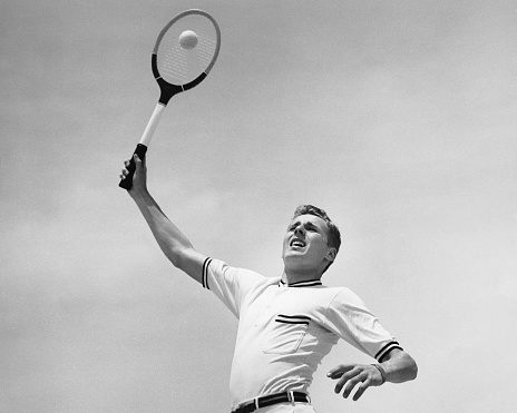 Tennis Player with a white uniform on a black and white background looking like a super hero.
