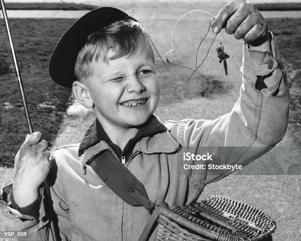 Boy Squinting At Baited Hook Stock Photo - Download Image Now - 1950-1959, Sport, Basket