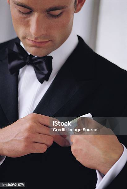 Man In Smoking Stock Photo - Download Image Now - Adjusting, Adults Only, Bow Tie