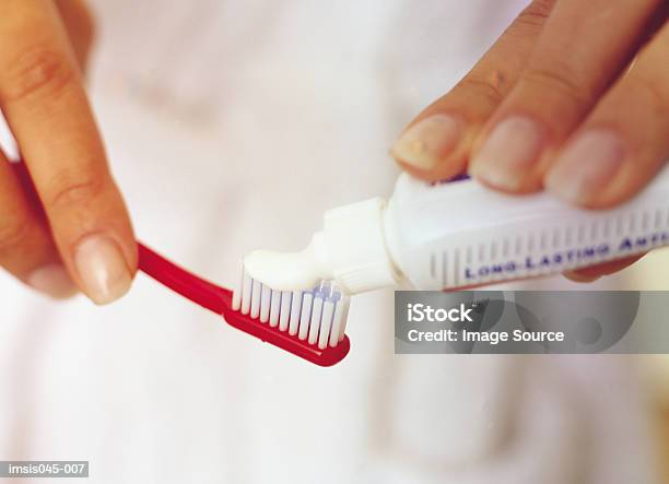 Toothbrush And Paste Stock Photo - Download Image Now - Toothpaste, Adults Only, Applying